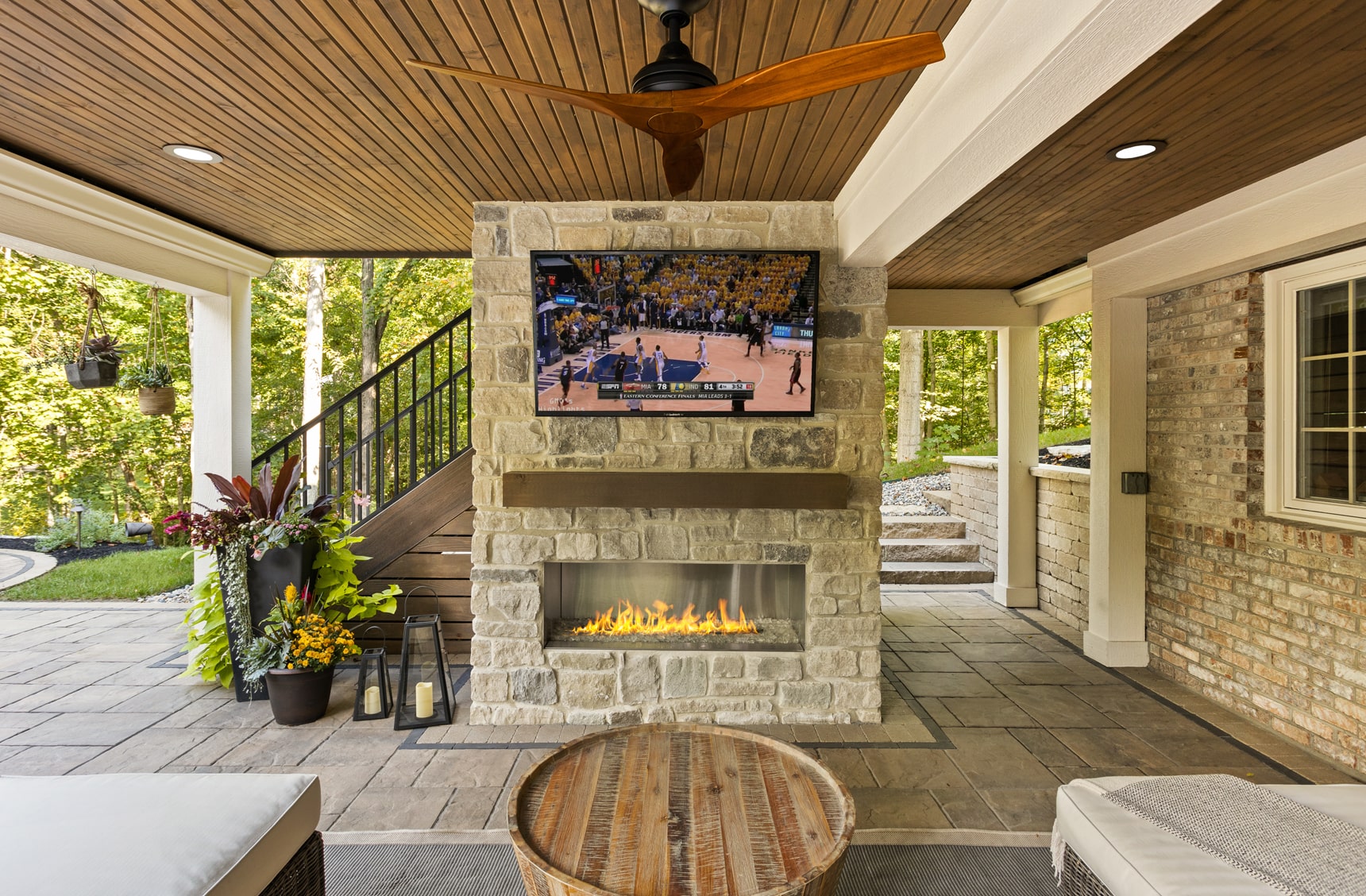 BPI outdoor living space with TV and fireplace