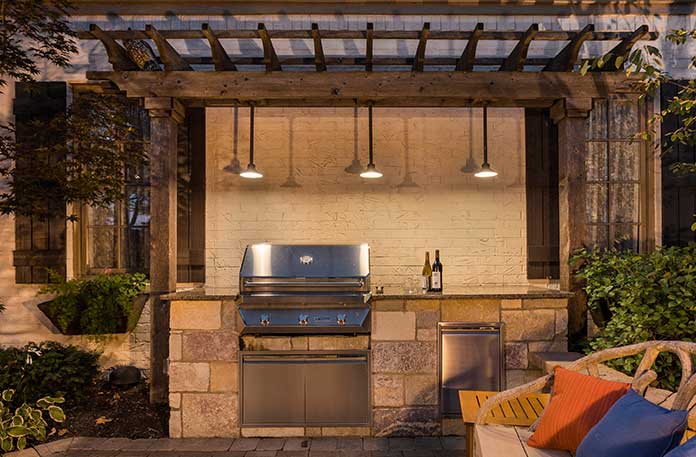 Grill with ambient lighting to create al fresco dining experience.