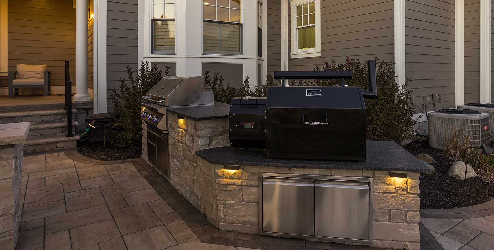 Grill and smoker combo outdoor kitchen.