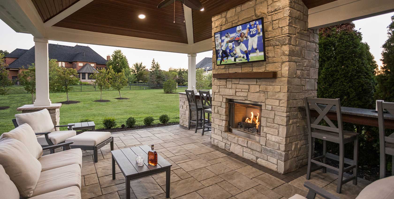 Outdoor living space with entertainment and coverage.