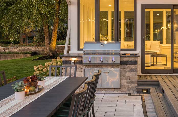 Outdoor grilling area with dining area.