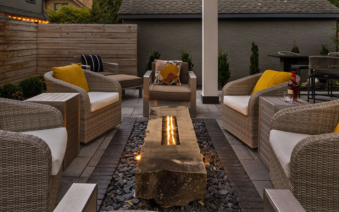 luxury outdoor living area featuring fire feature design.