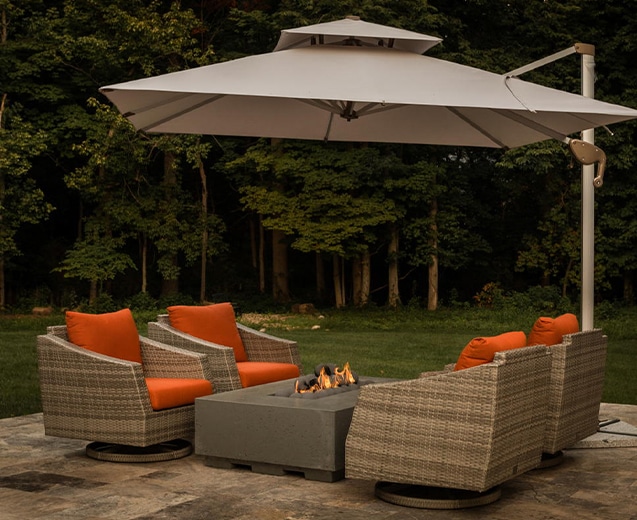 outdoor seating area with fit pit and umbrella