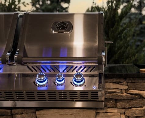 close up outdoor grill with light up knobs