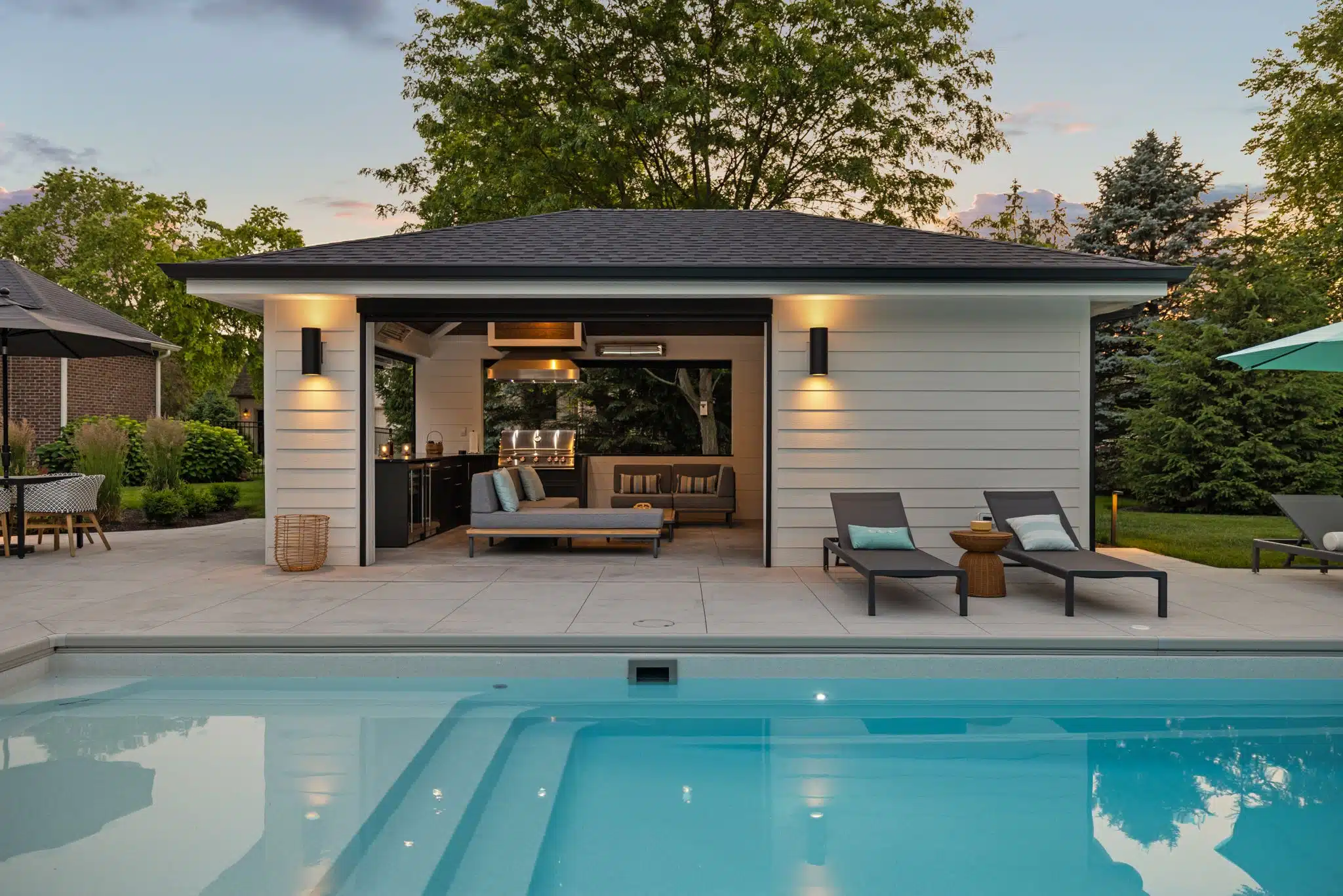 Luxury Outdoor Living Space With Pool and Outdoor Covered Structure in Zionsville