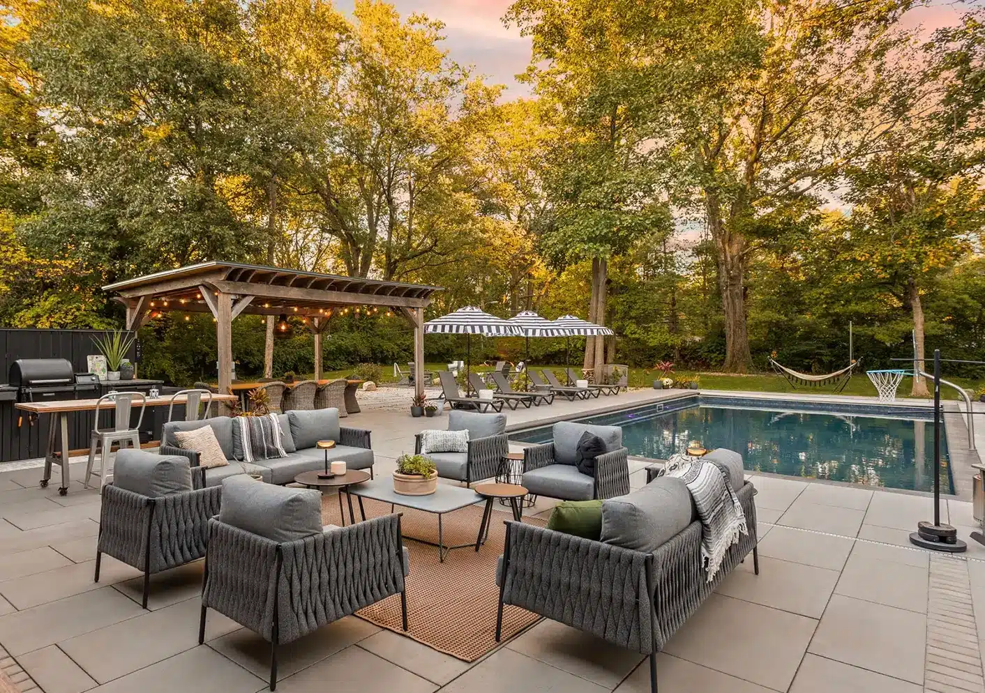 outdoor space with seating area, kitchen, pool and covered space